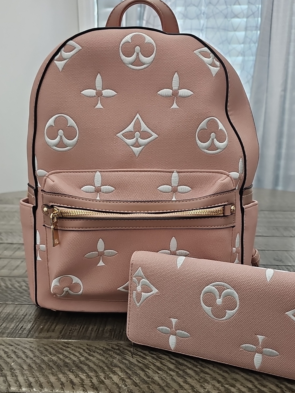 Pink Embossed Backpack with Matching Wallet